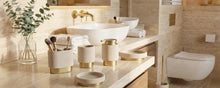 Warmynest cream ceramic bathroom set with brushed-gold bases on a warm travertine vanity