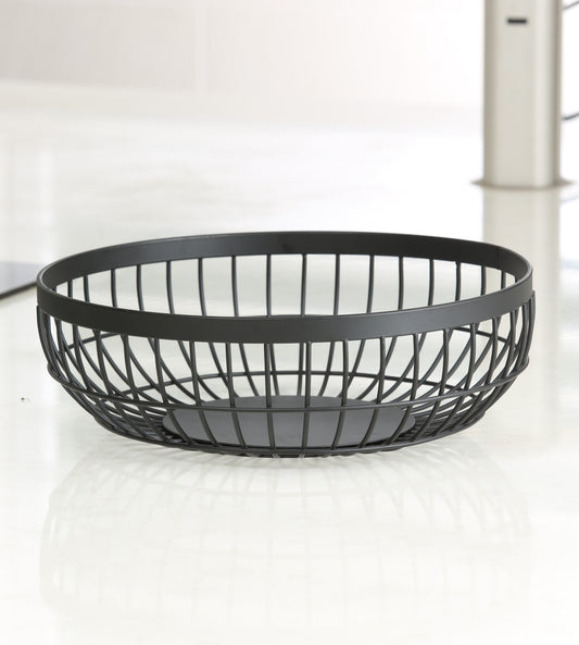 Empty matte black round wire fruit basket seen from the side, showing the crossed-wire lattice sides, wide flat rim band and solid round base