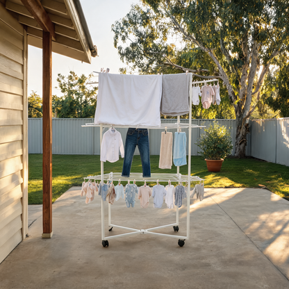 WarmyNest aluminium tower clothes airer in white, all six wings open and loaded with towels and sheets