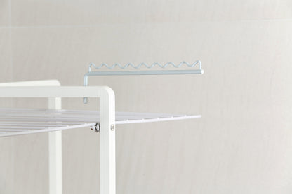 Close view of the polymer-coated steel rails and white aluminium frame of the tower clothes airer