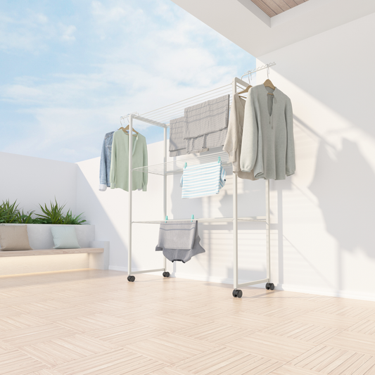 WarmyNest slimline 3-tier clothes airer in white, open with washing across all three tiers