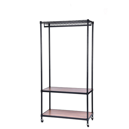 Three-tier garment rack, angled view, black metal frame on castors with a wire top shelf, a full-width hanging rail and two walnut-tone shelves