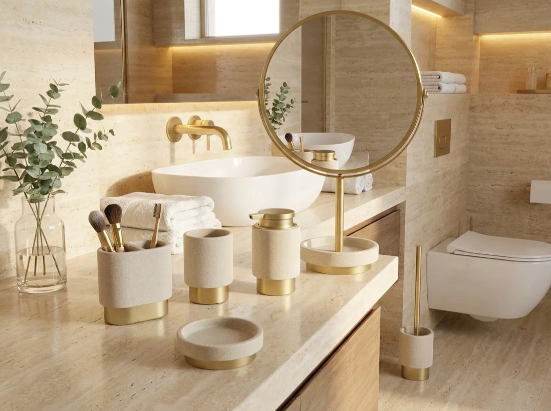 A full WarmyNest bathroom set — dispenser, tumbler, soap dish, brush holder and mirror — on a warm travertine vanity